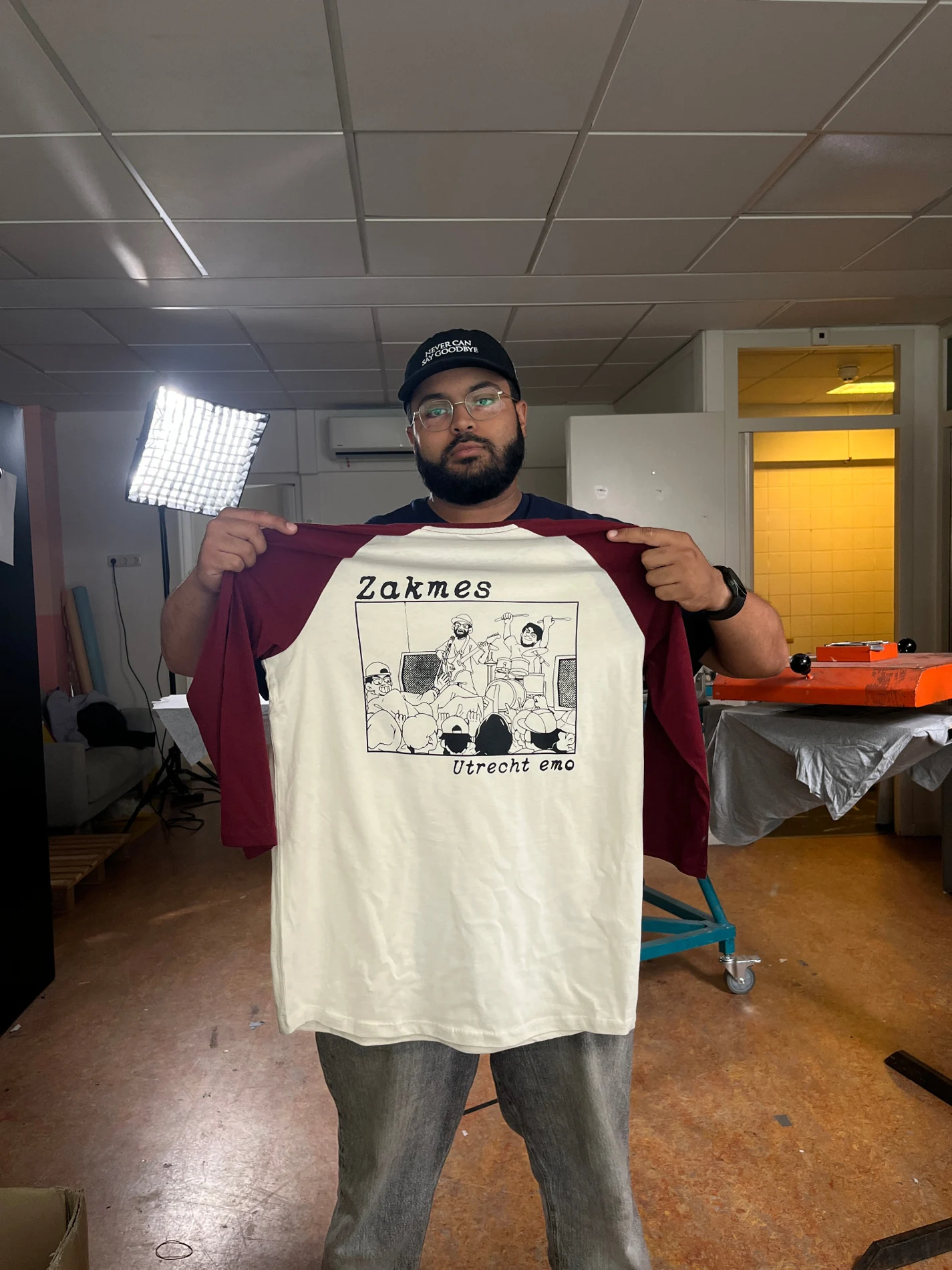 Cream and burgundy raglan shirt printed with Zakmes Utrecht emo band illustration
